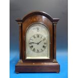 A mahogany-cased mantel clock with inlai