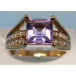 A 9ct gold ring set with an amethyst and