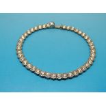 An 18ct white gold tennis bracelet set w