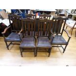 A set of six (4+2) oak upholstered dinin