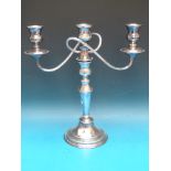 A silver plated three branch candelabra,
