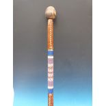 A knobkerrie with bulbous top, beaded mi