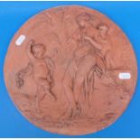 A 19thC circular terracotta plaque with