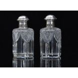 A pair of early 20thC Fabergé glass bott