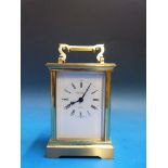 A brass carriage clock retailed by Marti