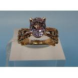 A 14k gold ring set with a large Kunzite