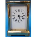 A French brass carriage clock with Roman