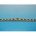 An 18ct gold bracelet set with emerald,