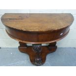 A 19thC mahogany demi-lune carved pier t