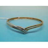 A 9ct gold bangle set with six graduatin