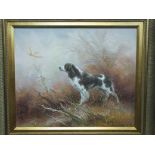 A modern oil painting of a spaniel flushing out a pheasant from undergrowth, in gilt frame