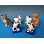A collection of ceramic cats including Staffordshire, Beswick etc