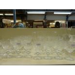 A large collection of cut glass drinking glasses and tableware to include wine glasses, ten