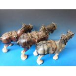 Four harnessed ceramic Shire horses and wooden cart