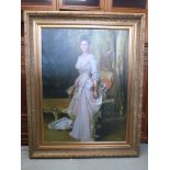 A large framed picture of a well dressed lady with fan