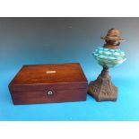 A mother of pearl inlaid writing slope and a cast oil lamp with blue bowl