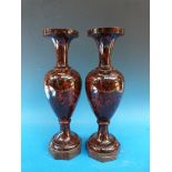 A pair of hardstone vases raised on octagonal marble bases