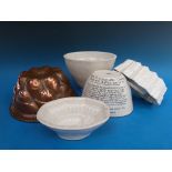 A collection of ceramic and copper jelly moulds including Shelley,