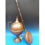 A copper and brass samovar and a warming pan