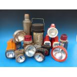 A collection of vintage torches and flasks,