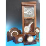 A collection of mantel clocks to include a miniature grandfather clock and an Art Deco example