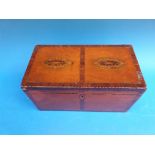 A Georgian mahogany inlaid and cross banded two dominion tea caddy