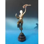 A bronze finished Art Deco style figure of a girl with bird,