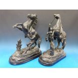 A pair of Marley spelter figures of rearing horses