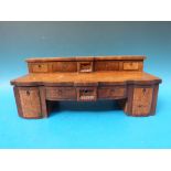 A 19thC apprentice walnut pedestal sideboard opening to reveal a fitted jewellery box,