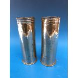 A pair of trench art WWI shell cases engraved with oriental decoration