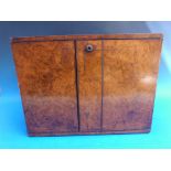 A burr walnut campaign style collector's cabinet or cigar humidor,