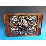 A c1920s hardwood tray with butterfly wing decoratopm depicting tropical views and a parrot