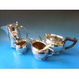 A Hukin & Heath three piece silver plated tea set together with another plated hot water jug