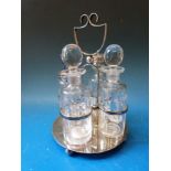 A silver plated four bottle cruet with cut glass bottles