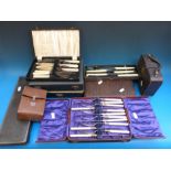 A quantity of boxed plated cutlery sets,