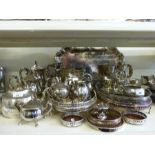 A large collection of plated ware including trays, tea sets, cruet,