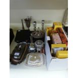 A quantity of silver plated ware including candlesticks, boxed cutlery, butter dishes,