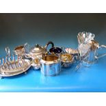 A quantity of silver plate to include tea sets,