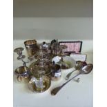 A quantity of silver plate including candelabra, tankards, basting spoon,