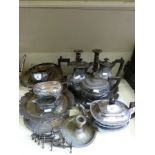 A quantity of silver plated items to include candlesticks, tea sets, basket,