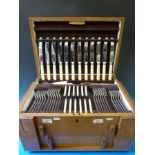 An oak-cased canteen of cutlery by James Dixon and Son,