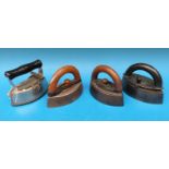 Four lozenge shaped smoothing irons with detachable handles or slugs including Jas.