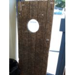 A probably teak ship's door,