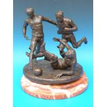 A bronze of three possibly 19thC footballers, on shaped marble base,