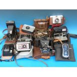 A collection of vintage cameras including Protor II, Voigtlander, Kodak,