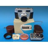 A Lordomat S E Rangefinder camera in box with instructions together with a Weston light meter and