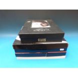 Four Elvis Presley boxed CD sets together with various ephemera