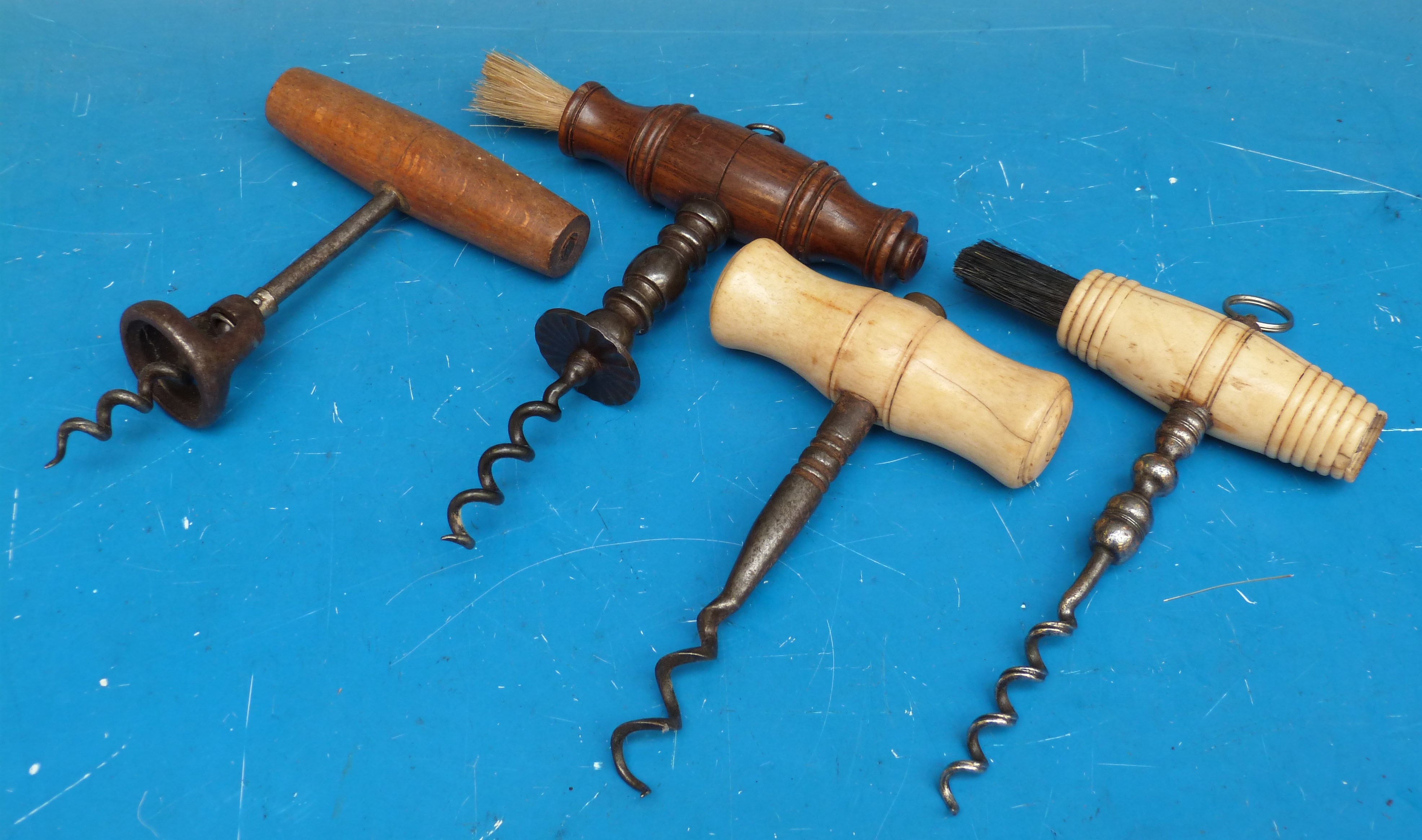A collection of corkscrews including 19thC bone and wooden handled,