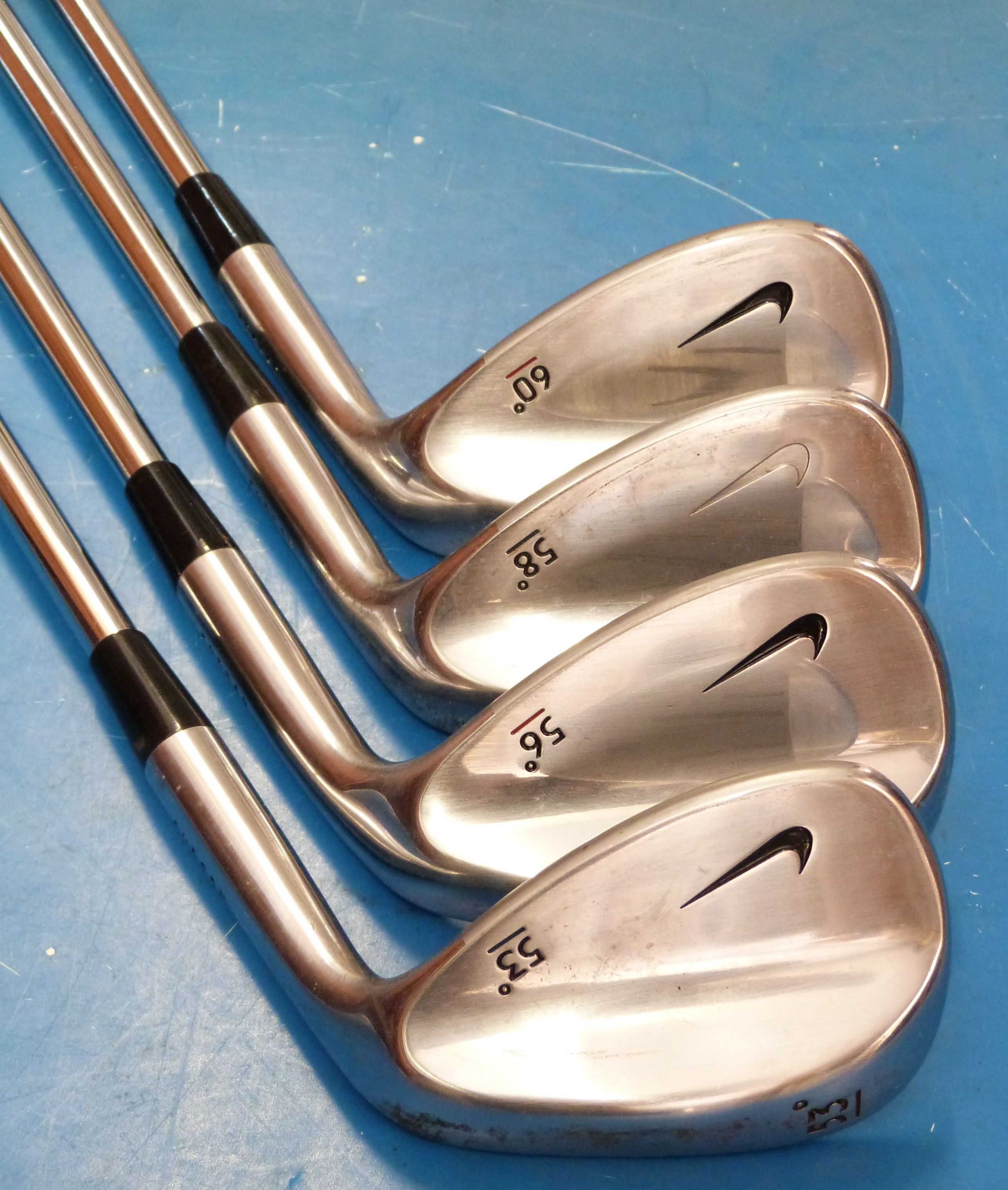 A set of four Nike golf wedges 53°, 56°, 58°,