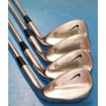 A set of four Nike golf wedges 53°, 56°, 58°,